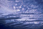 Altocumulus cloud billows with silvery Duplicatus clouds