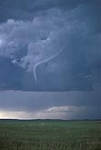 A tornadic funnel thins in the rope stage of a tornado life cycle 