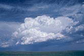 A boiling thunderhead in a changing sky