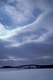 Smooth sweeping clouds in snowy landscape