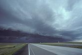 An Arcus, or shelf cloud, over a highway
