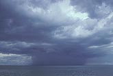 A heavy rain storm over lake water