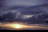 Several different cloud types in a peaceful, golden sunset