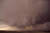 Large, brushy, rotating wall cloud under a supercell storm