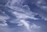 Dreamy abstract skyscape with puffs and waves of cloud