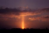 Sun pillar in a sunrise sky filled with ice crystals