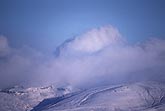 Blanket of cloud on mountain in winter