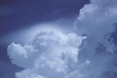 Billowing cloud tops with soft pileus cap cloud