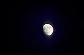 Close-up of three-quarter moon in black night sky