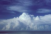 Billowing bank of clouds over ocean