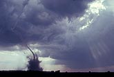 Skinny rope-like tornado, funnel bent by outflow