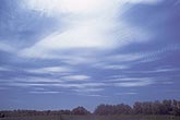 High lenticular Altocumulus cloud patches