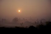 Sun through dense early morning fog