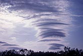 Lenticular clouds in crest of standing wave, part of a set of lee waves