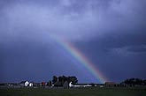 Rainbow arc brings hope to a farmhouse