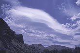 Multi-tiered wave cloud over a mountain