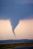 A tornado’s condensation funnel, tapering to a needle