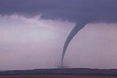 Mature tornado with curved funnel and debris cloud
