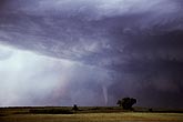 Tornadic supercell features in an overview with distant tornado