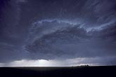A high-based supercell in dry air with a circular wall cloud
