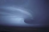 Raging supercell mesocyclone with beaver tail cloud