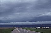 A roll cloud moving forward from a squall line