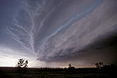 Vertically stacked shelf cloud with smoothly sculpted wedge