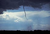 Tornado size versus strength: wide debris cloud and skinny funnel