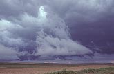 Irregular scud clouds against dark storm bases