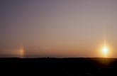 A sundog (parhelion) cause by ice crystals in misty morning air