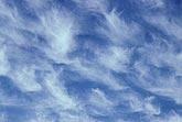 Abstract of wispy cloud tufts in a joyous sky
