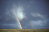 As a storm is ending a rainbow enchants the landscape
