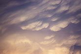 Close view of Mammatus clouds on the underside of an anvil