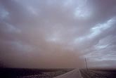 A dust storm wall obscures the sky