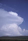 A convective tower overshoots a storm anvil
