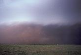 A severe storm brings a duststorm with wall of red dust