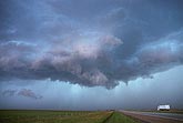 A ragged, weakening wall cloud has become flatter and less compact