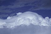 Pileus clouds smother a storm top with a downy blanket
