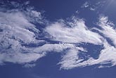 Strangely shaped cloud patches create a sense of fluid motion