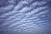 Cloud billows fill the sky with a regular pattern as a series of small waves pass through