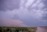 An ominous dust storm with a rust-colored cloud of dust