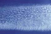 Close-up section of a jet condensation trail (contrail)