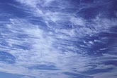 Bright, intricately detailed streaks of cloud 