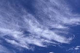 Sweeping cloud wisps with diagonal fallstreaks 