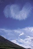 A heavenly winged cloud in a mountain landscape