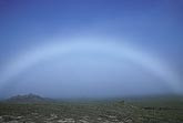 A fogbow, with white light instead of the spectrum of a rainbow