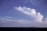 A Cumulus tower grows and changes into an anvil