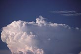 A small cloud tuft, or jumping Cirrus, above an anvil cloud