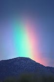 A heavenly rainbow with intense color spectrum on a mountain top