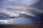 An Arcus cloud surrounds the rain and hail curtain on a storm